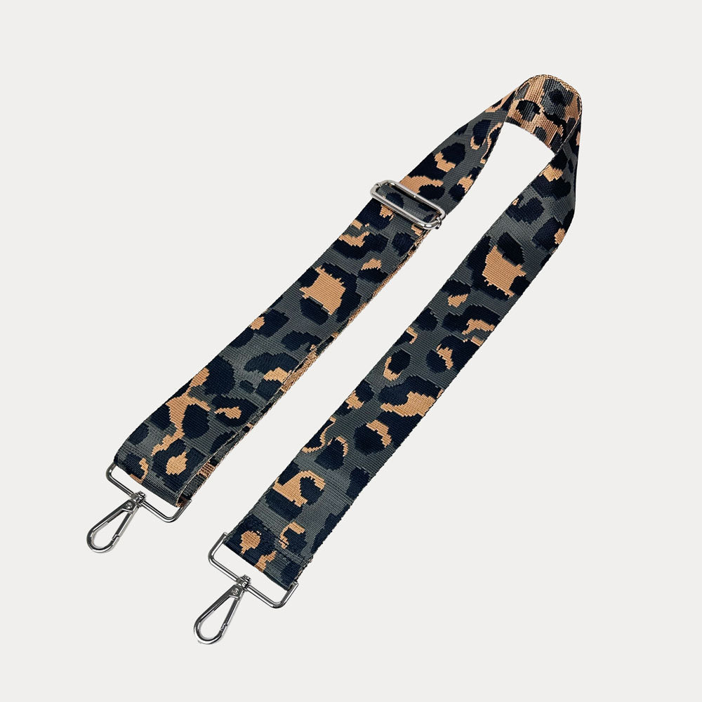 Dark Grey Leopard print bag strap with silver metal clasps on a white background