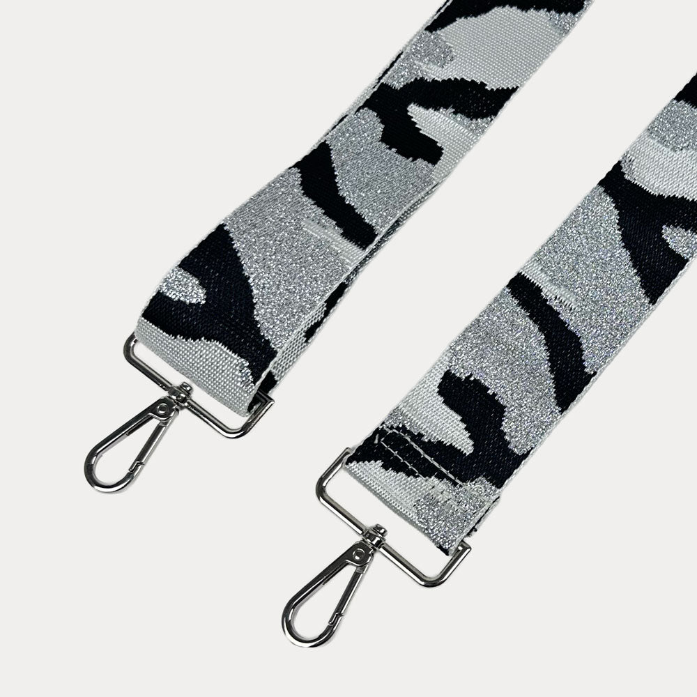 White, grey, and black camouflage patterned strap with silver metal clasps