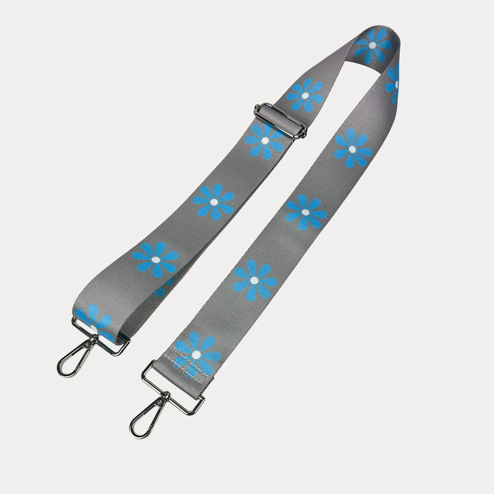 Grey ground with Light Blue Flower Print bag strap with silver metal clasps on light grey background