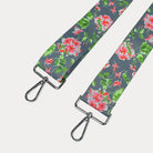 Grey ground floral patterned strap with silver hardware on a light gray background