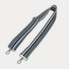 Grey, White, and Navy striped bag strap with silver hardware light gray background