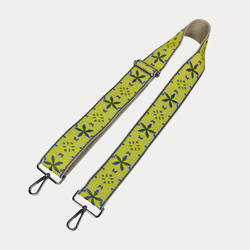 Cream ground with Yellow Floral pattern bag strap  with silver metal clasps on a light gray background
