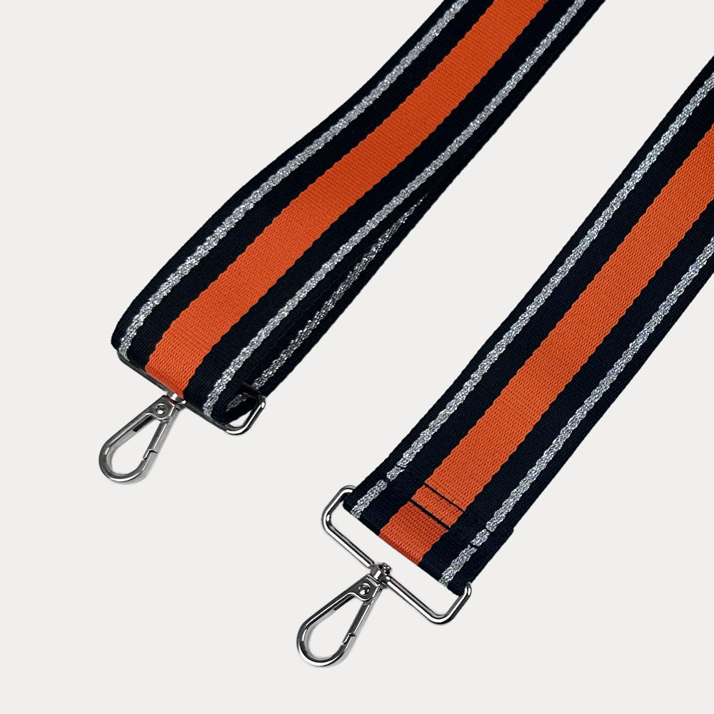 Orange, Navy, and Silver Metallic Striped bag strap with silver hardware on a light gray background