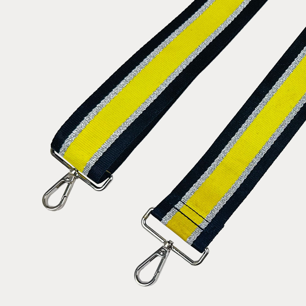 Black, Yellow, and Silver Metallic Striped bag strap with silver hardware on a light gray background