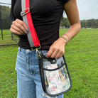 Woman wearing the Breanna Clear Messenger with Vegan Black Leather
