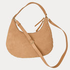 Ginger vegan suede handbag with studs on a light gray background