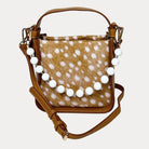Handbag with deer pattern vegan suede and camel vegan leather details on a beige background