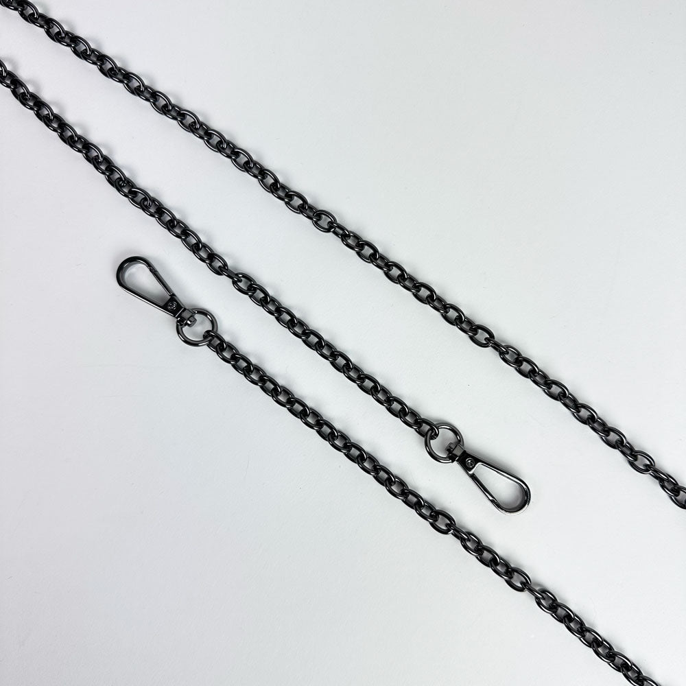 Gunmetal metal chain strap on a light grey background