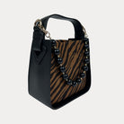 Handbag with Zebra Print and  Black Vegan Leather Details with Black Bead Trim. Side View