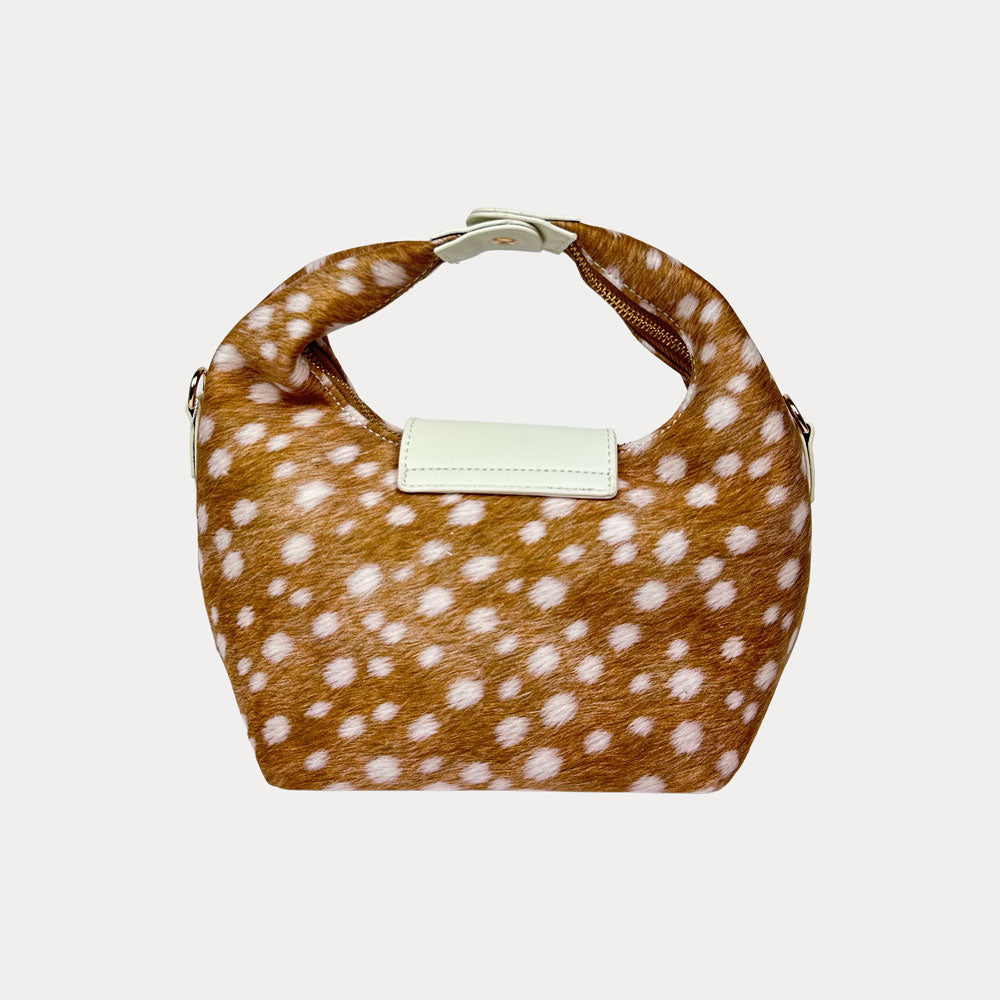 Handbag with deer print and cream leather accents on a light gray background- Back View