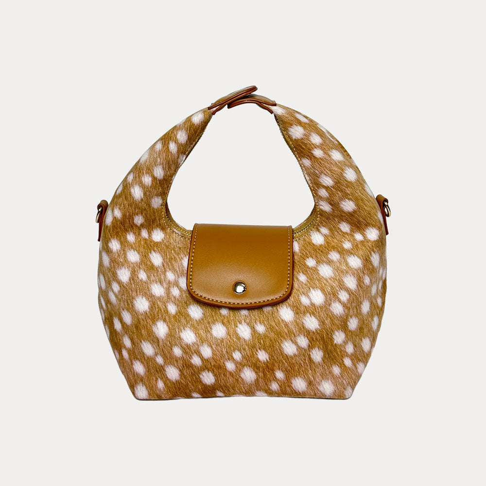 Handbag with deer print and camel leather accents on a light gray background- Front View