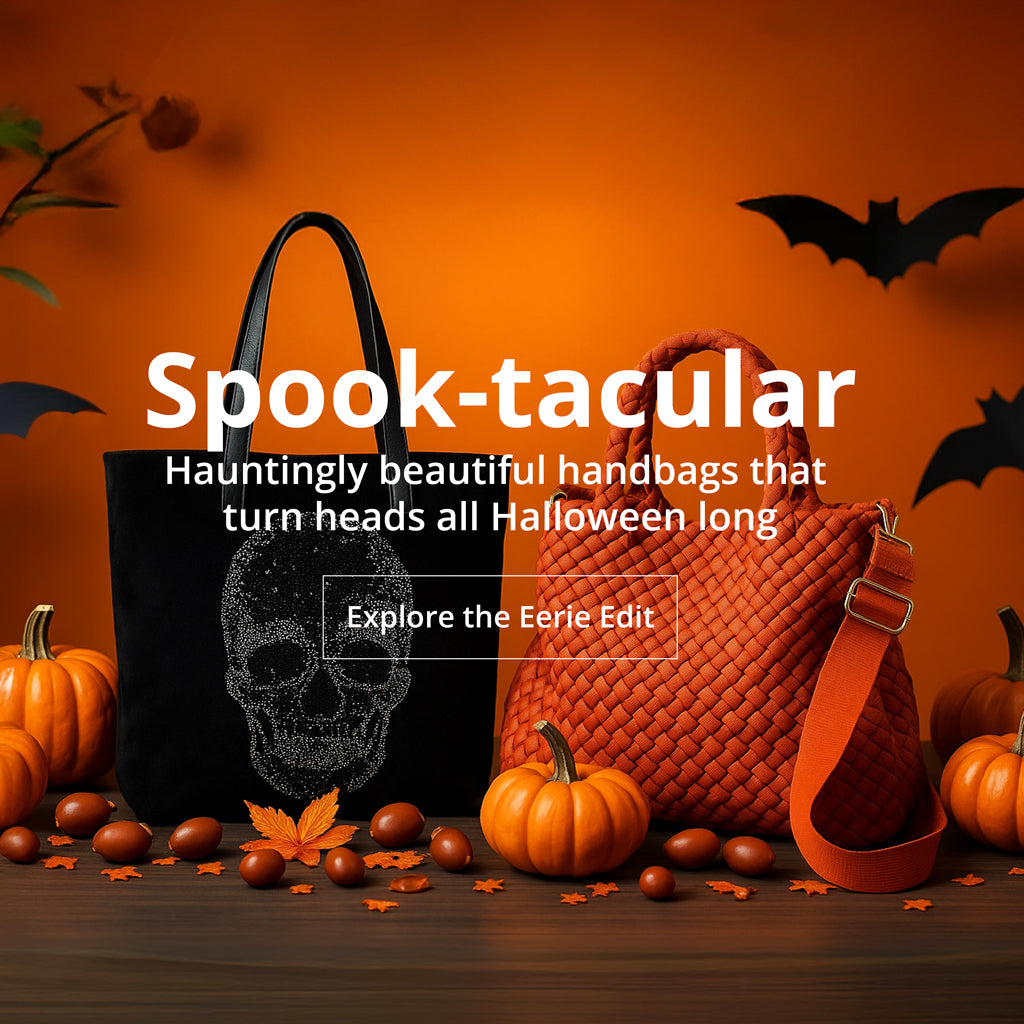 Two handbags, one black with skull design and one orange woven bag, on an orange background with pumpkins and bats. Text: Spook-tacular, Hauntingly beautiful handbags that turn heads all halloween long.  Button: Expolor the Eerie Edit. 