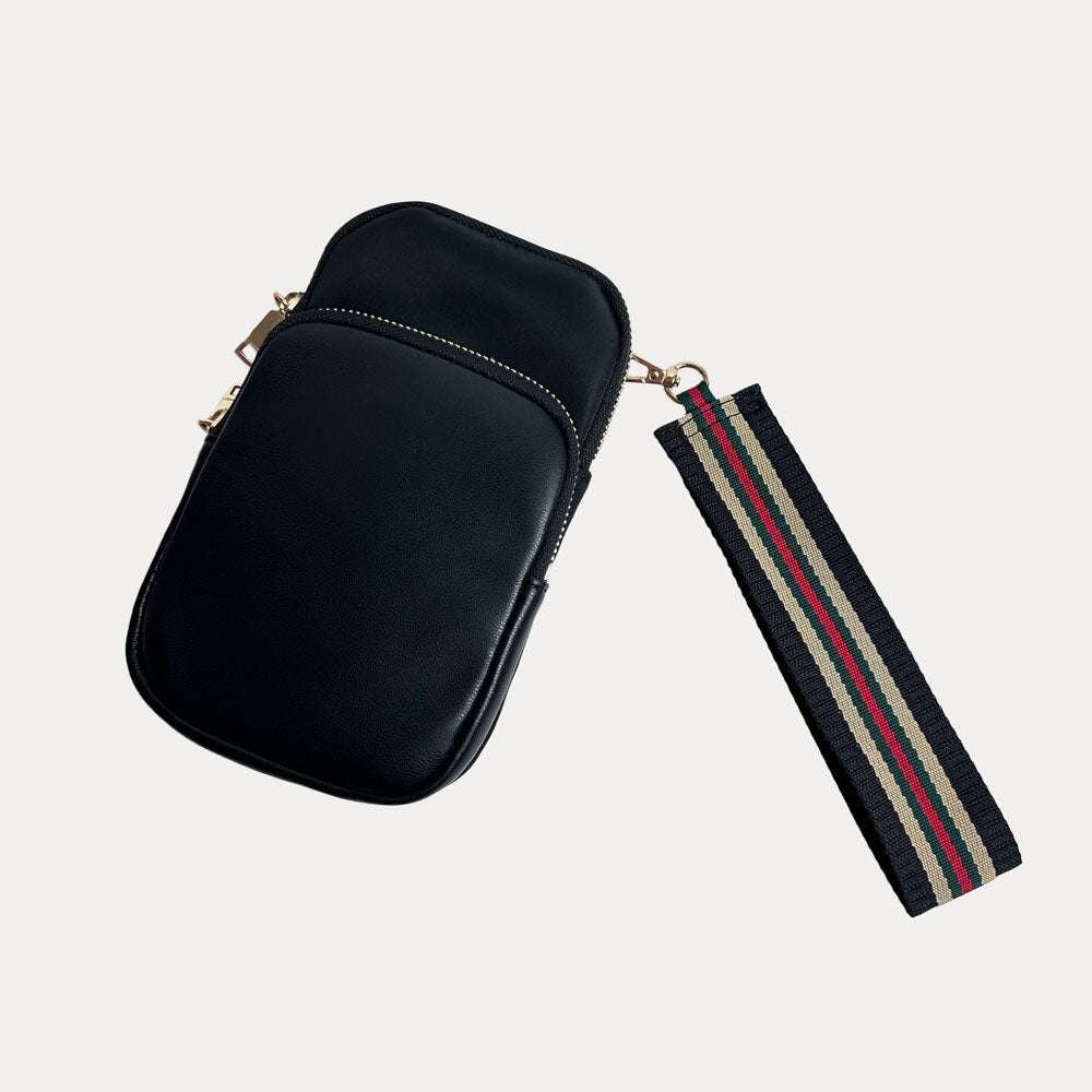 Black leather pouch with a striped wristlet strap on a light gray background