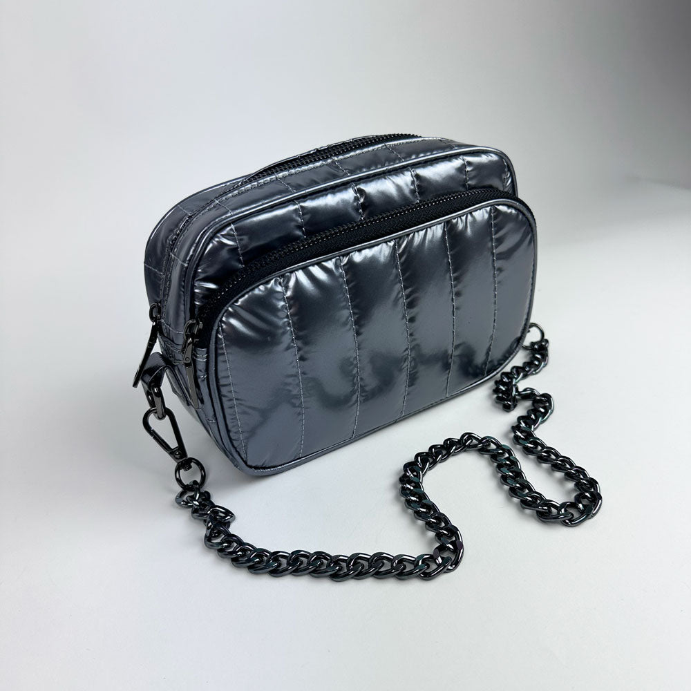 pewter handbag with pewter chain bag strap on a light grey background