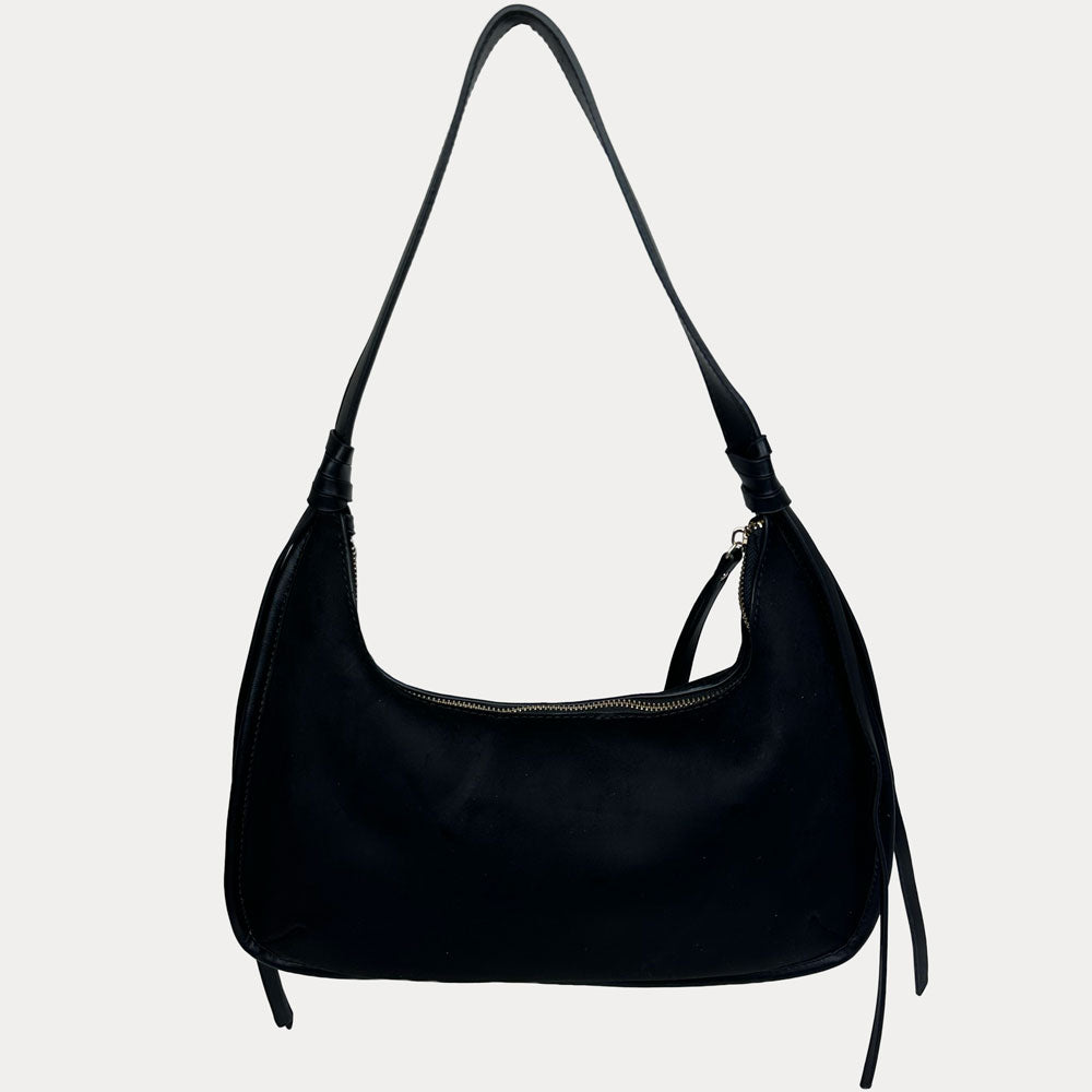 A black leather shoulder bag with a vegan leather shoulder strap, shown against a plain light gray background.