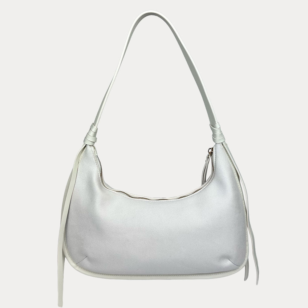 A cream vegan suede shoulder bag with a vegan leather strap, shown against a plain light gray background.