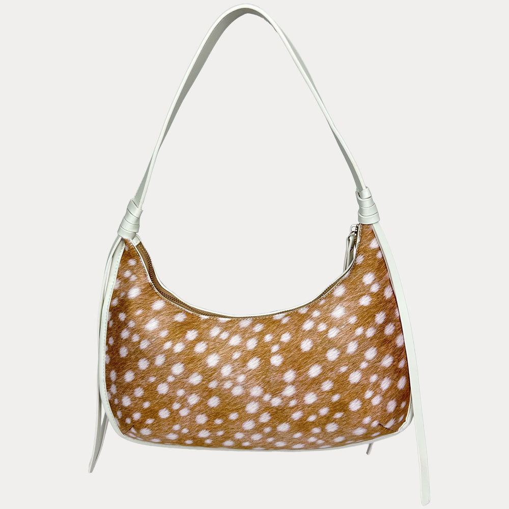 A shoulder bag with a deer animal print body and a cream strap, shown against a plain light gray background.