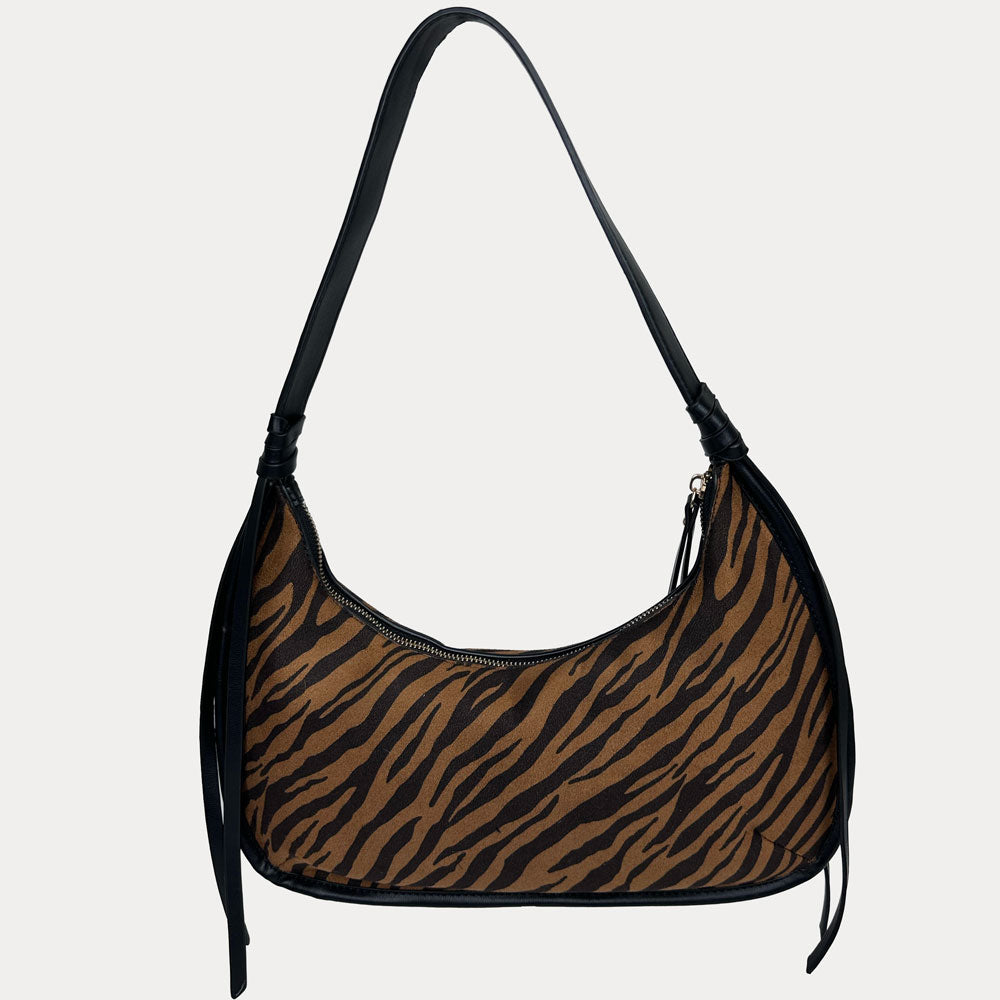 A brown and black zebra-print shoulder bag with black vegan leather shoulder strap, shown against a light gray background.