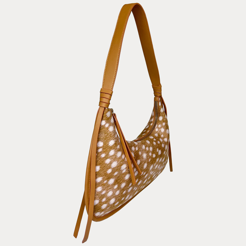 A shoulder bag with a deer animal-print body and matching camel vegan leather strap, shown on a plain light gray background.