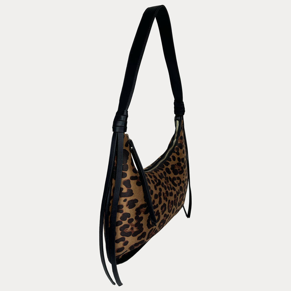 A shoulder bag with a brown and black leopard print body and solid black strap, shown against a light gray background.