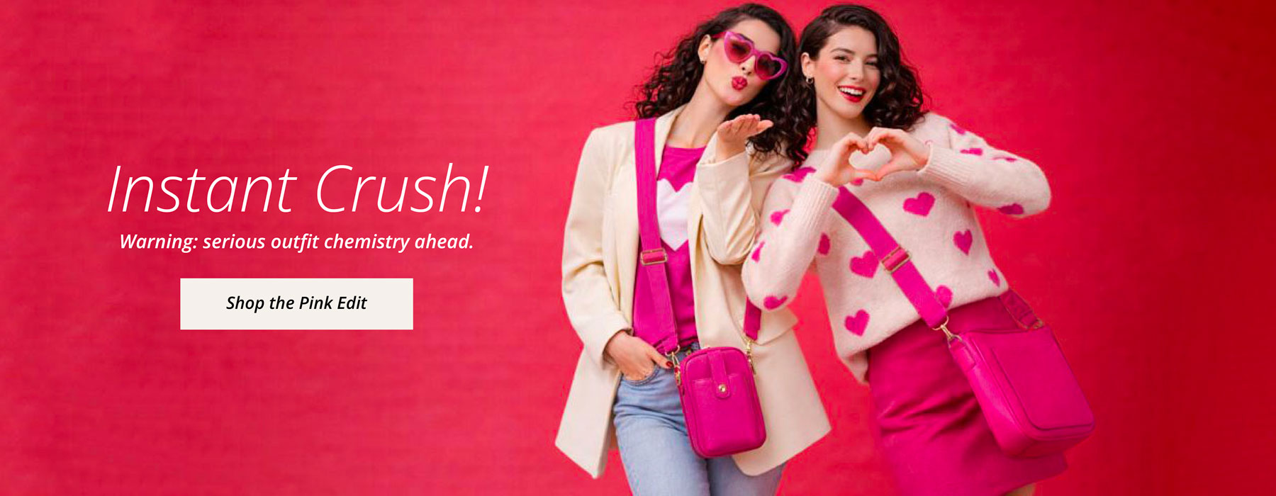 Two women posing against a pink background with text- Instant Crush! Warning Serious outfit chemistry ahead. Shop the Pink Edit