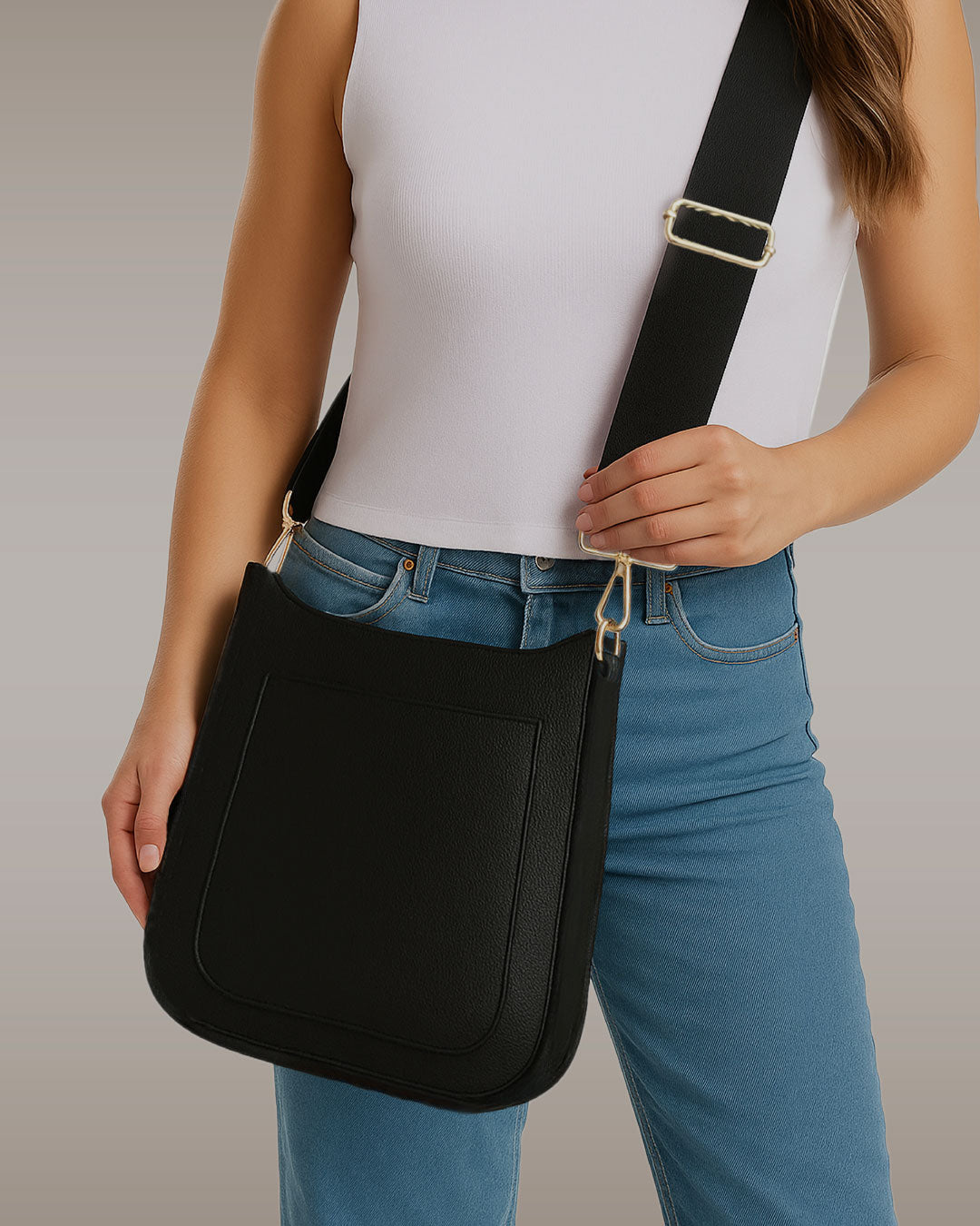 Woman wearing the maxine vegan pebble leather messenger as a crossbody