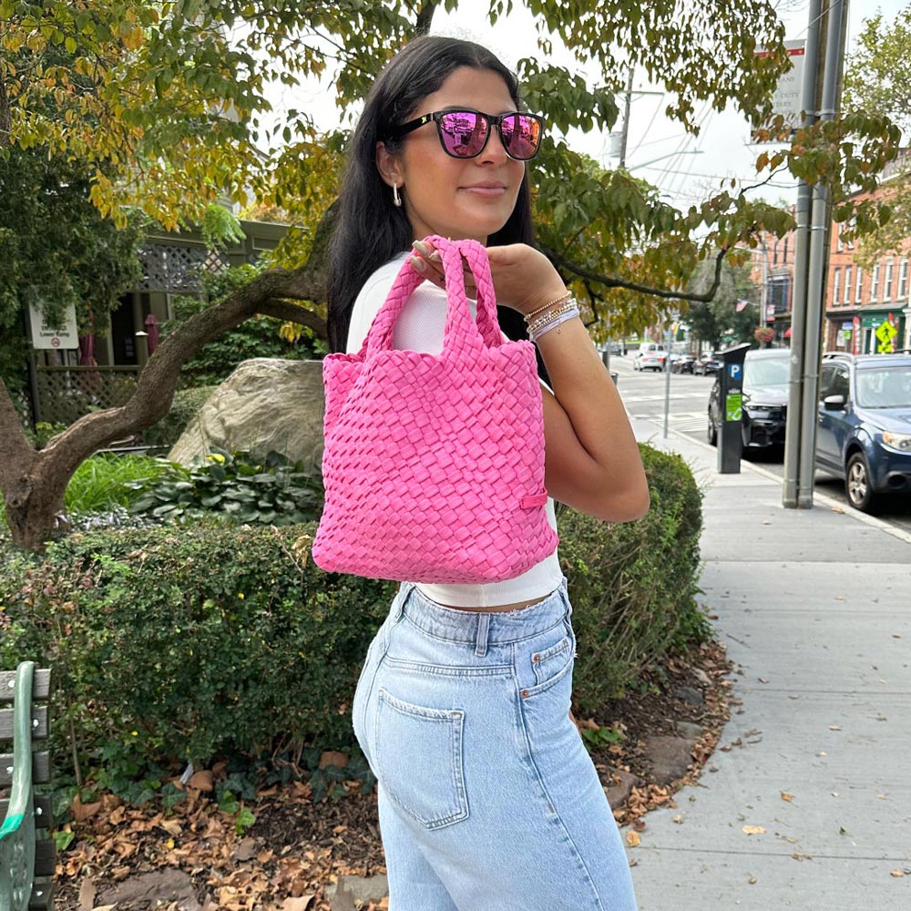 Woman holding the Pink Linda Woven Velour Tote