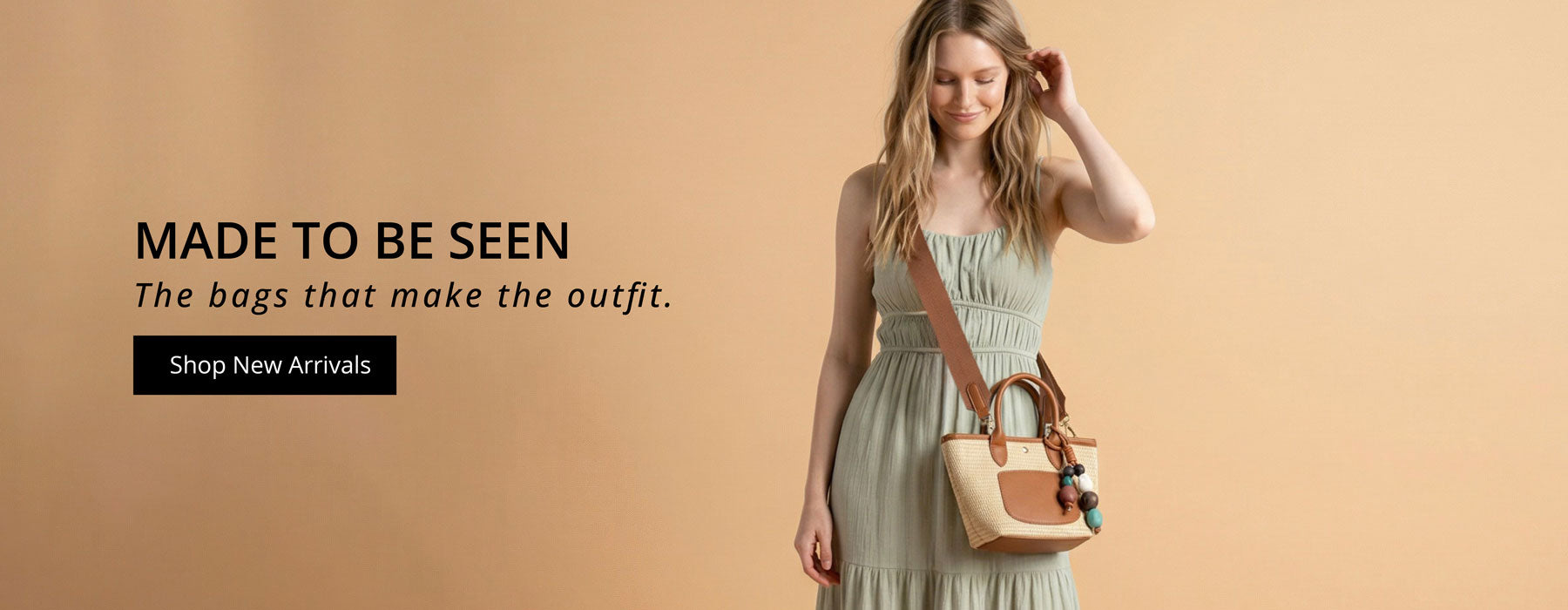 Woman holding wearing a raffia handbag with text: Made to be seen, the bags that make the outfit, on a beige background.  Button: Shop New Arrivals